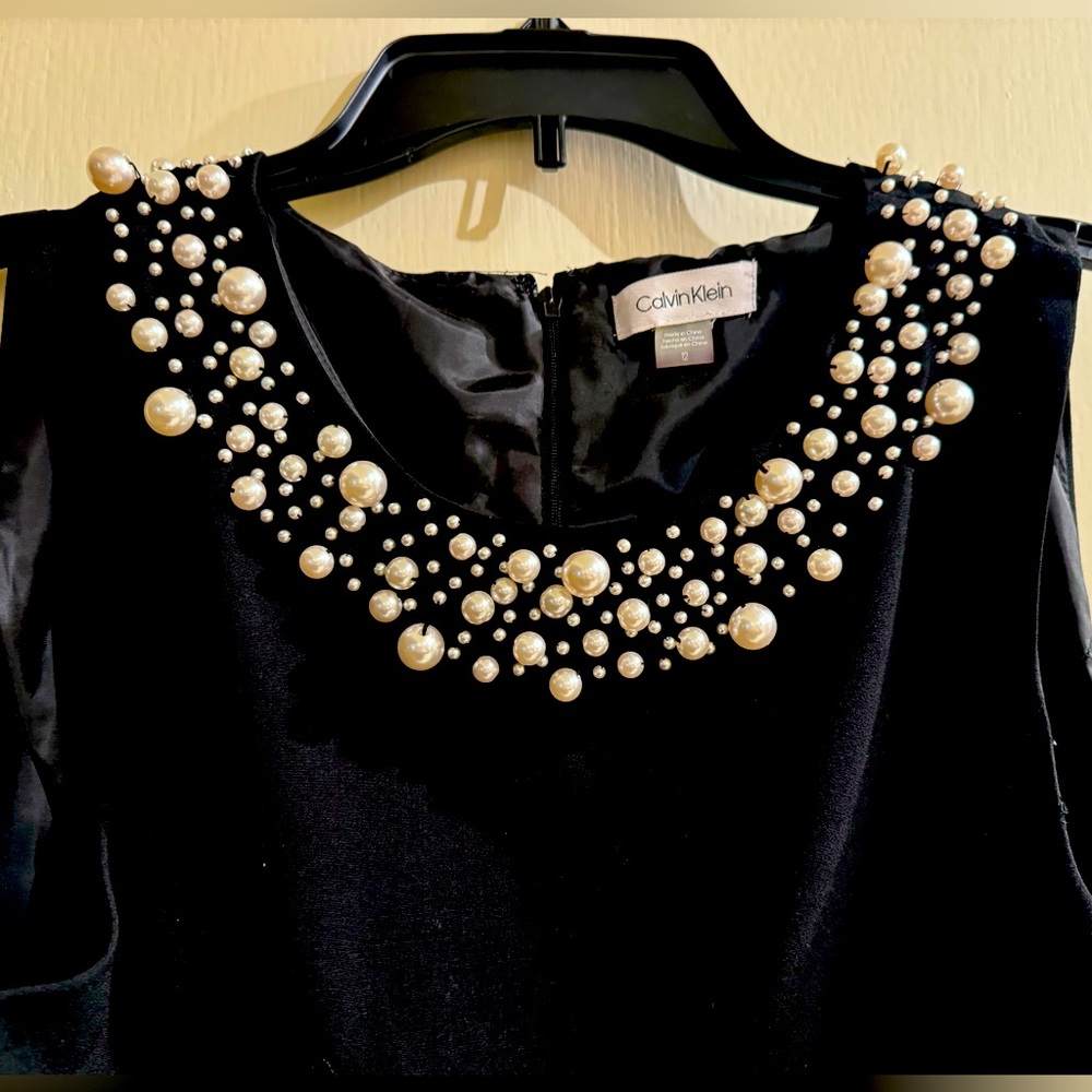 Calvin Klein Black with pearl’s around neckline size 12. Just above knee.